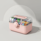 Pink medicine organizer with various pills on a light gray background