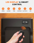 Black electronic device with LED display and remote control on a wooden surface