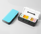 Blue pill organizer and white open pill organizer on a light gray background