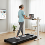 Woman using a treadmill in a home office setting with a desk and computer.